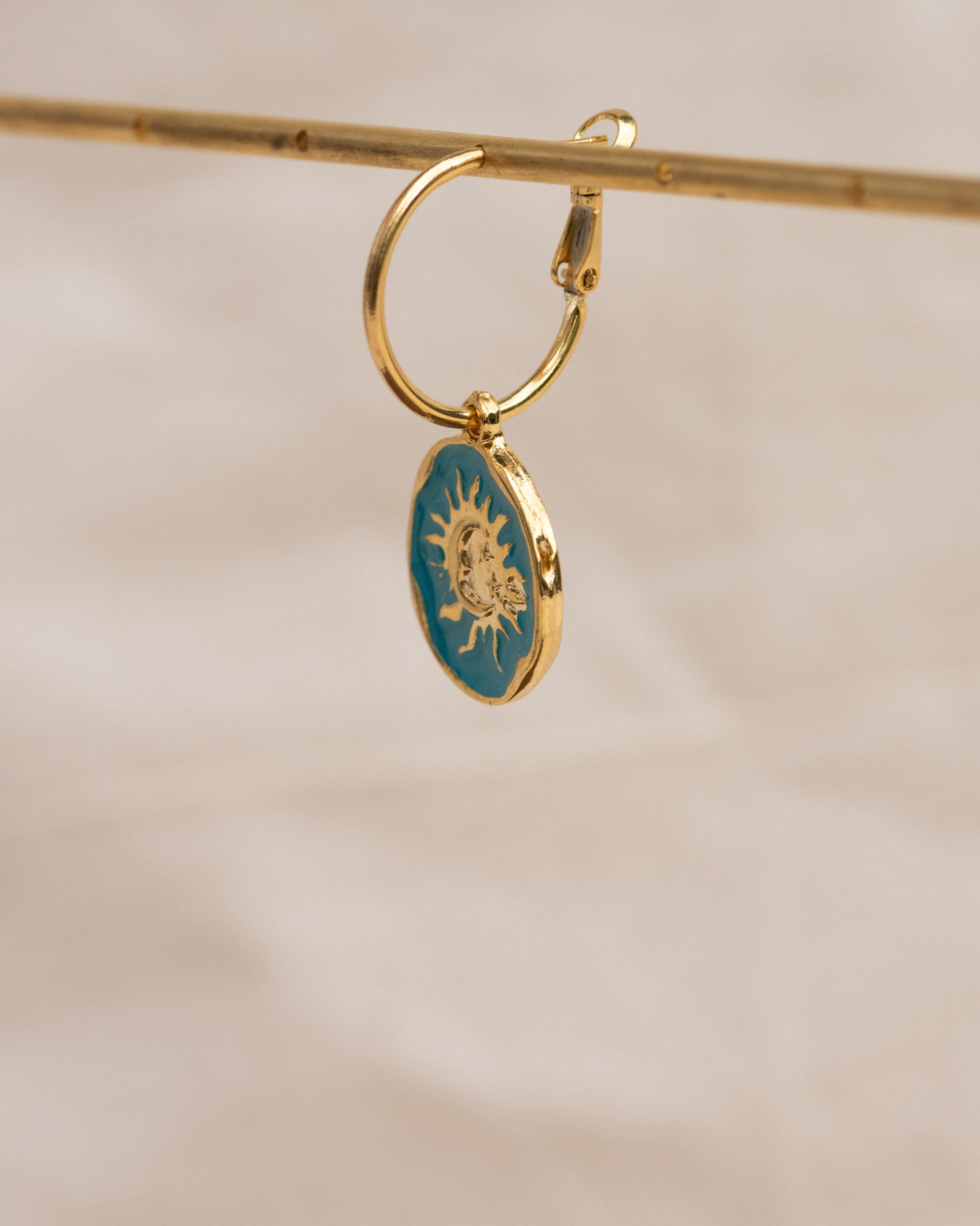 Celestial Charm Single Hoop Earring: Sun & Moon Ocean Embrace Design