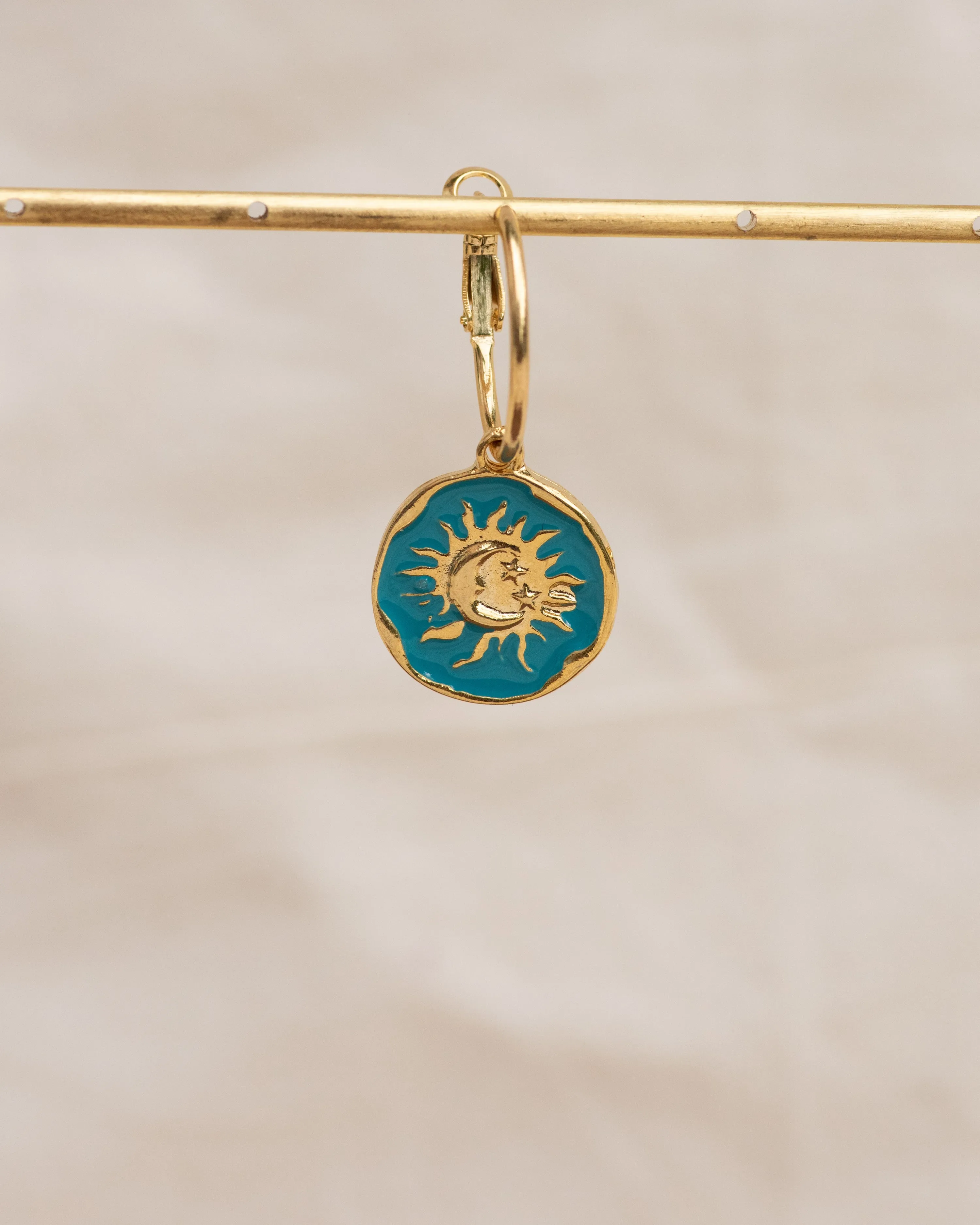 Celestial Charm Single Hoop Earring: Sun & Moon Ocean Embrace Design